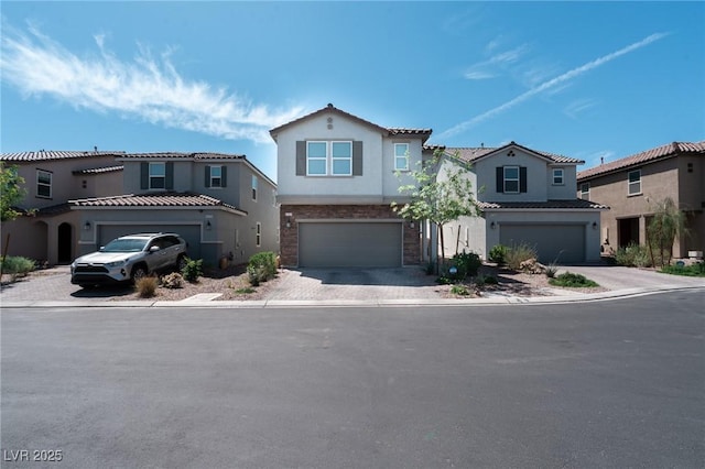 view of front of home featuring an attached garage, a tile roof, driveway, and stucco siding