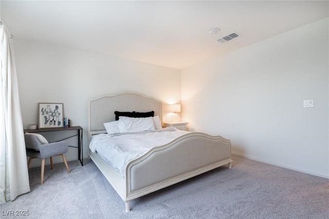 carpeted bedroom with baseboards and visible vents