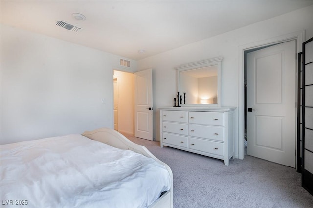 bedroom with light carpet and visible vents