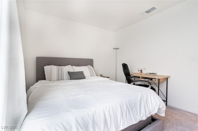 bedroom featuring visible vents, carpet flooring, and baseboards