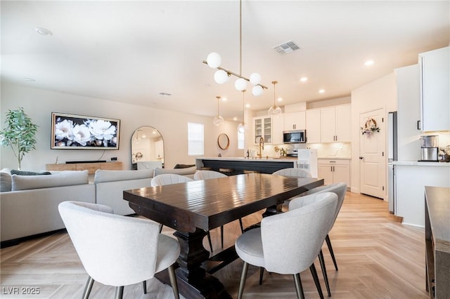 dining space featuring visible vents and recessed lighting