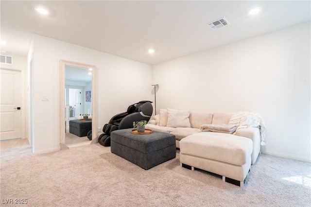 carpeted living area with baseboards, visible vents, and recessed lighting