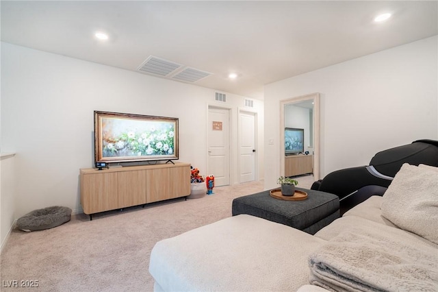 living area featuring recessed lighting, visible vents, and light carpet