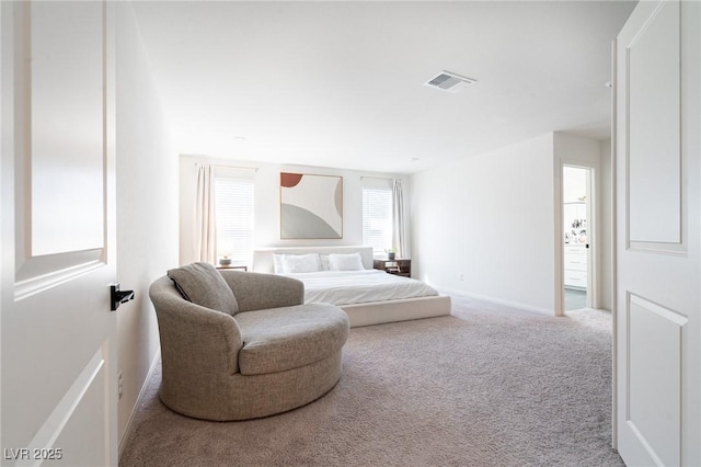 carpeted bedroom with baseboards and visible vents
