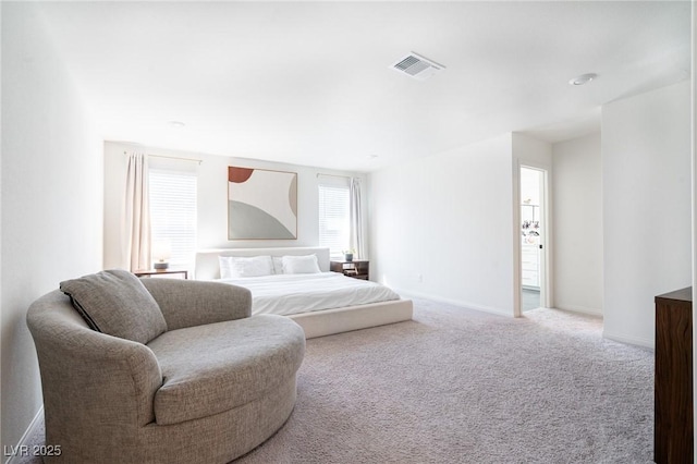 bedroom featuring baseboards, visible vents, and carpet floors