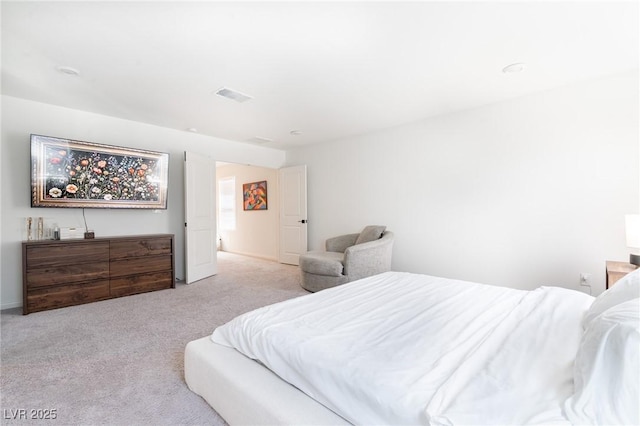 carpeted bedroom featuring visible vents