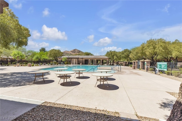 10412 Deer Heights St, Las Vegas, NV 89178 - community pool with fence and a patio