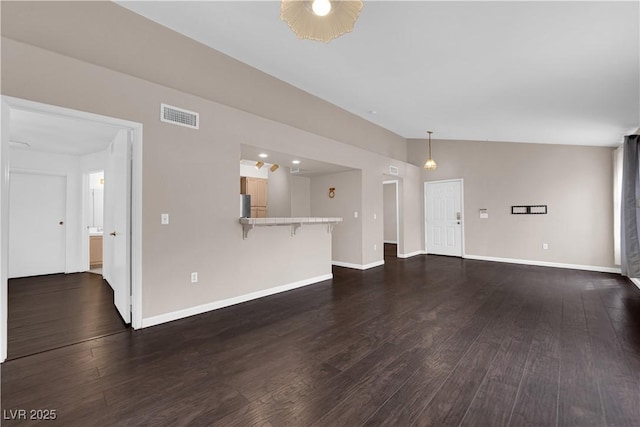 7950 W Flamingo Rd Unit 2019, Las Vegas, NV 89147 - unfurnished living room featuring baseboards, visible vents, and dark wood finished floors