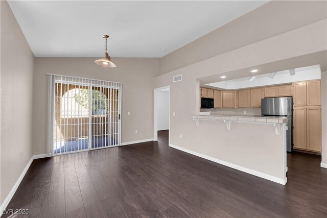 7950 W Flamingo Rd Unit 2019, Las Vegas, NV 89147 - unfurnished living room with lofted ceiling, baseboards, visible vents, and dark wood finished floors