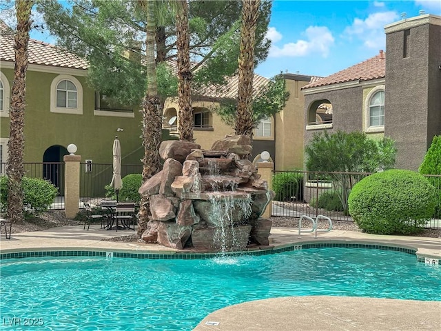 7950 W Flamingo Rd Unit 2019, Las Vegas, NV 89147 - community pool with fence and a patio area