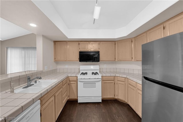 7950 W Flamingo Rd Unit 2019, Las Vegas, NV 89147 - kitchen featuring tile counters, white appliances, and light brown cabinetry