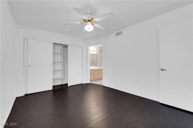 7950 W Flamingo Rd Unit 2019, Las Vegas, NV 89147 - unfurnished bedroom featuring visible vents, wood finished floors, a closet, ceiling fan, and ensuite bath