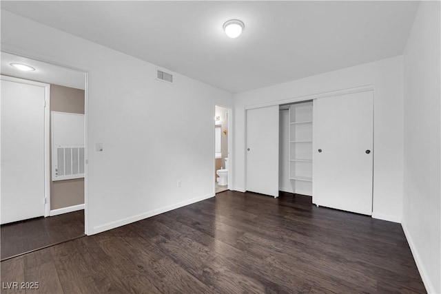 7950 W Flamingo Rd Unit 2019, Las Vegas, NV 89147 - unfurnished bedroom with wood finished floors, visible vents, a closet, baseboards, and ensuite bathroom