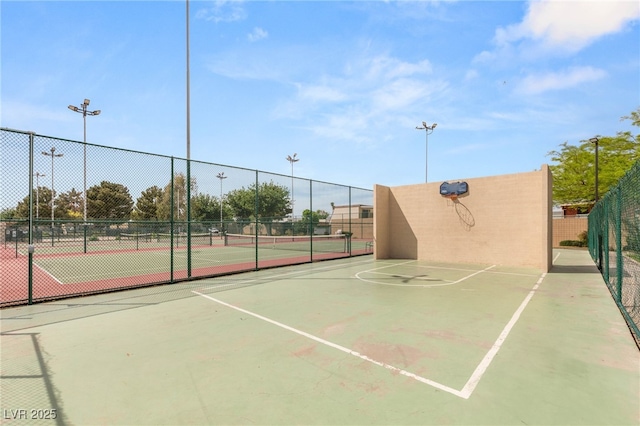 view of sport court featuring community basketball court and fence
