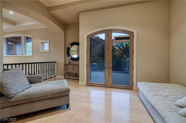 1520 Macdonald Ranch Dr, Henderson, NV 89012 - living room featuring light wood-style floors, arched walkways, french doors, ornamental molding, and recessed lighting