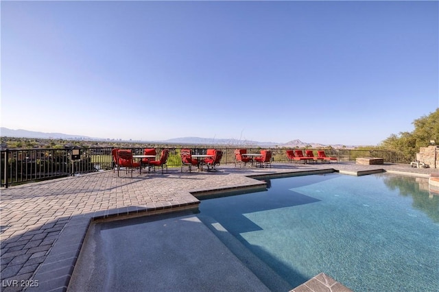 1520 Macdonald Ranch Dr, Henderson, NV 89012 - view of swimming pool featuring a mountain view, a patio, and a fenced in pool