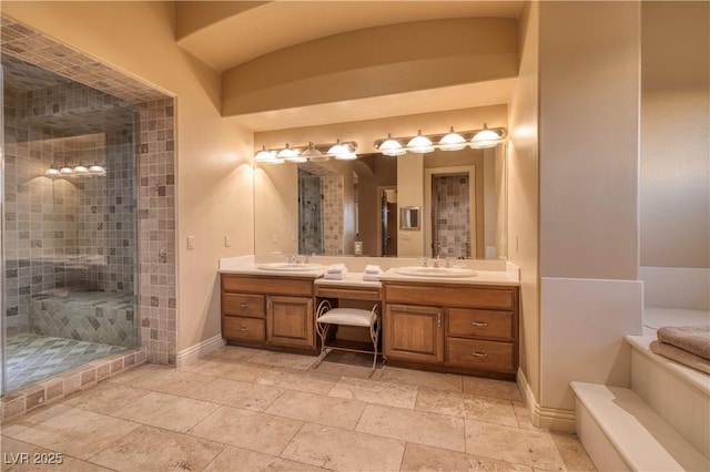 1520 Macdonald Ranch Dr, Henderson, NV 89012 - bathroom with baseboards, a sink, double vanity, and a stall shower