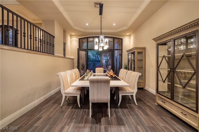 1520 Macdonald Ranch Dr, Henderson, NV 89012 - dining room featuring dark wood-style floors, a raised ceiling, baseboards, and an inviting chandelier