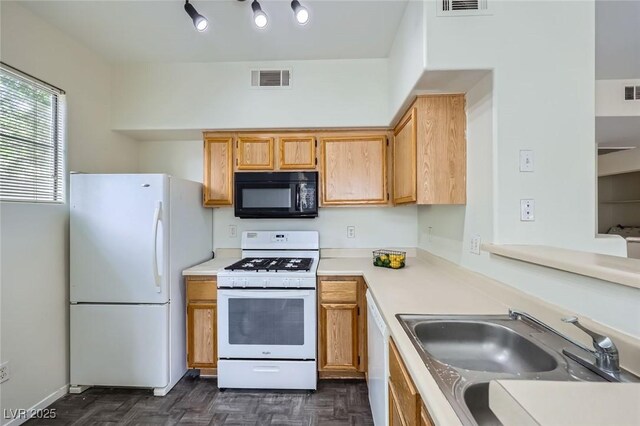 9050 W Warm Springs Rd Unit 1132, Las Vegas, NV 89148 - kitchen featuring visible vents, light countertops, white appliances, and a sink