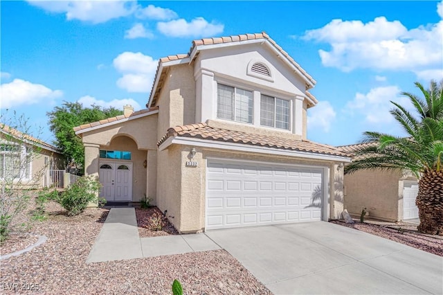 mediterranean / spanish-style home with stucco siding, a tiled roof, concrete driveway, and a garage