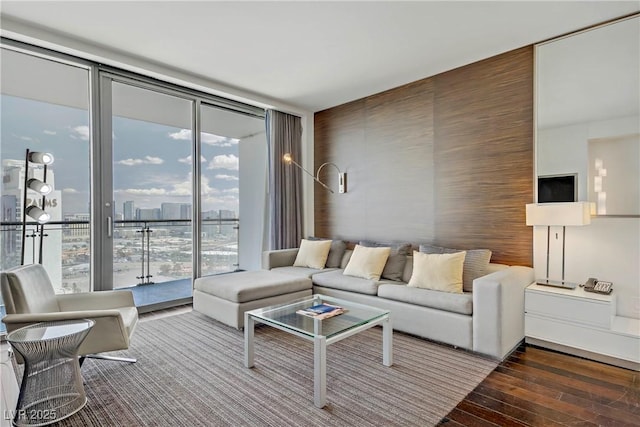 4381 W Flamingo Rd Unit 27308, Las Vegas, NV 89103 - living area with expansive windows and wood finished floors