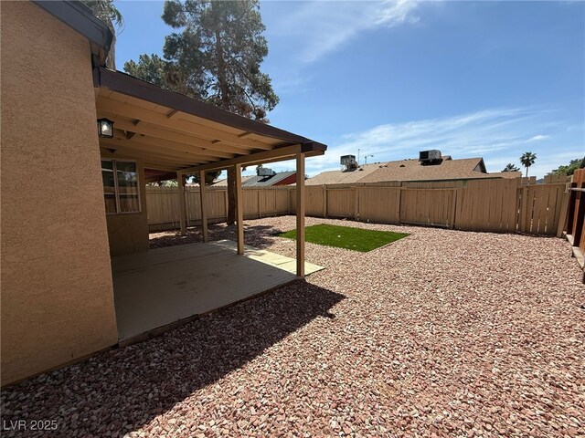 5653 White Cap St, Las Vegas, NV 89110 - fenced backyard with a patio area