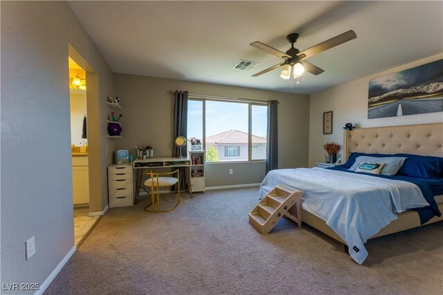 carpeted bedroom featuring connected bathroom, ceiling fan, baseboards, and visible vents