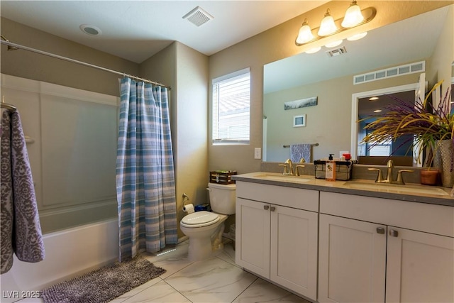 bathroom featuring visible vents and a sink