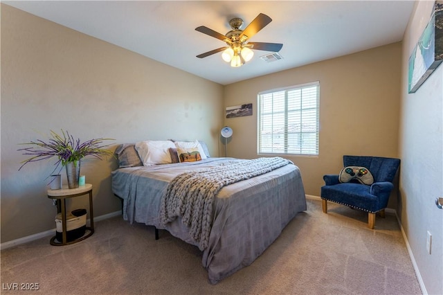 bedroom featuring light colored carpet, baseboards, and visible vents