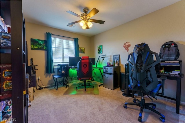 rec room with visible vents, carpet floors, and ceiling fan