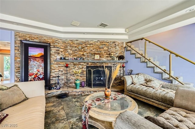 7165 Mira Monte Cir, Las Vegas, NV 89120 - living area with a fireplace, a raised ceiling, visible vents, and stairs