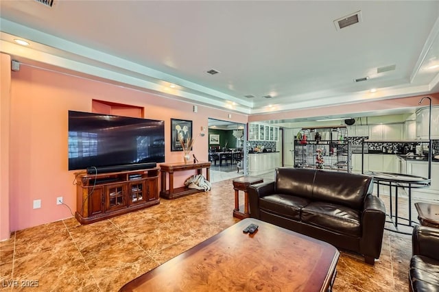 7165 Mira Monte Cir, Las Vegas, NV 89120 - living room with a tray ceiling and visible vents