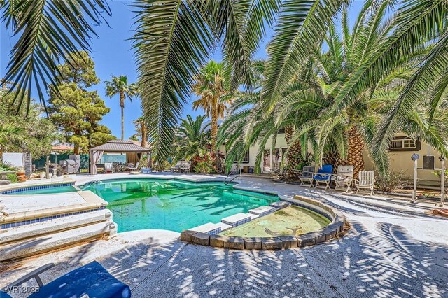 7165 Mira Monte Cir, Las Vegas, NV 89120 - view of swimming pool featuring a gazebo, a patio area, and a pool with connected hot tub