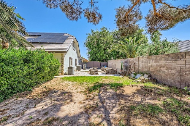 7165 Mira Monte Cir, Las Vegas, NV 89120 - view of yard featuring a fire pit, a patio area, cooling unit, and a fenced backyard