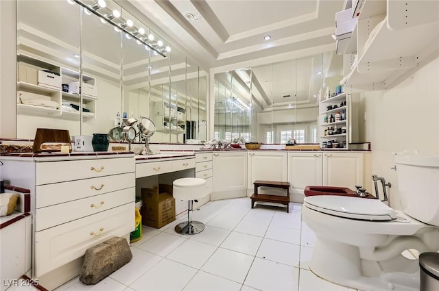7165 Mira Monte Cir, Las Vegas, NV 89120 - bathroom featuring a tray ceiling, tile patterned flooring, and toilet