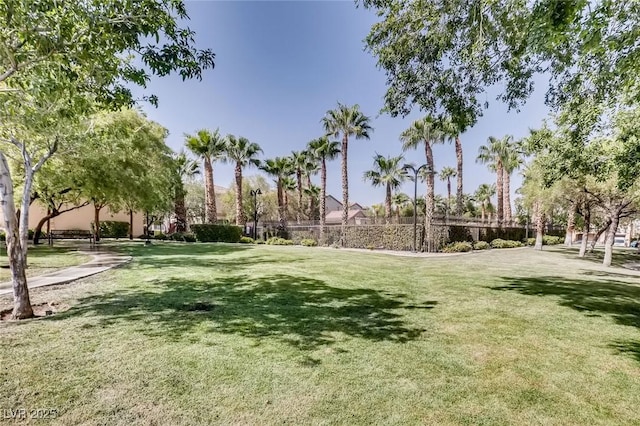 7165 Mira Monte Cir, Las Vegas, NV 89120 - surrounding community with a yard and fence