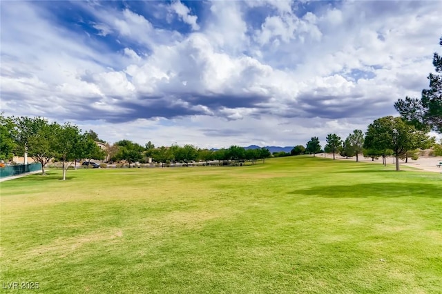 7165 Mira Monte Cir, Las Vegas, NV 89120 - view of property's community featuring golf course view, a lawn, and a mountain view