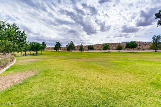 7165 Mira Monte Cir, Las Vegas, NV 89120 - surrounding community with view of golf course and a yard