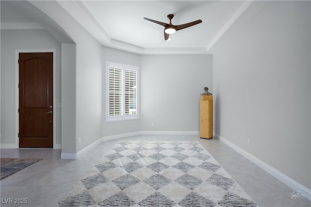 1130 Calico Rdg, Mesquite, NV 89034 - spare room featuring a raised ceiling, ceiling fan, and light tile patterned flooring