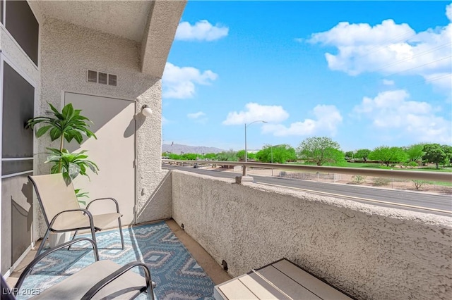 balcony featuring a mountain view