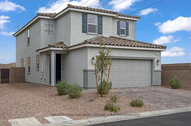 5692 Tinar St, Las Vegas, NV 89113 - view of front of home with an attached garage, a tiled roof, fence, and stucco siding