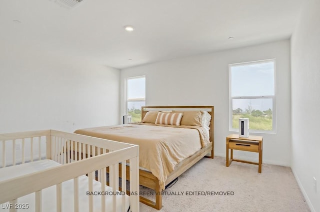 5692 Tinar St, Las Vegas, NV 89113 - bedroom featuring baseboards, visible vents, and light colored carpet