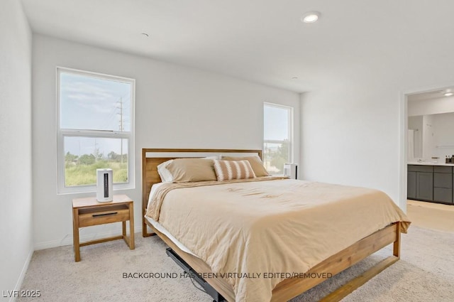 5692 Tinar St, Las Vegas, NV 89113 - bedroom featuring light carpet, ensuite bath, baseboards, and recessed lighting