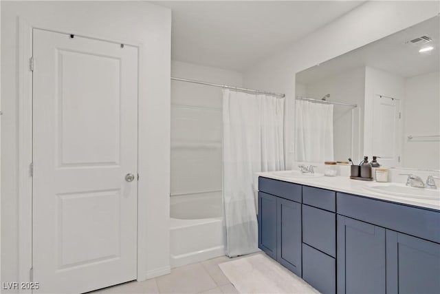 5692 Tinar St, Las Vegas, NV 89113 - full bath featuring double vanity, shower / bath combo with shower curtain, and tile patterned floors