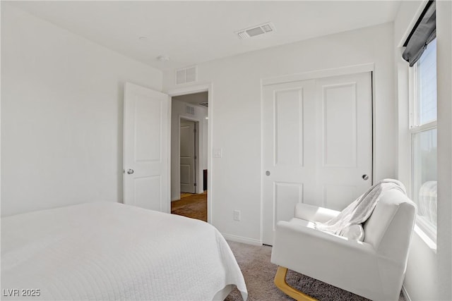 5692 Tinar St, Las Vegas, NV 89113 - bedroom featuring baseboards, visible vents, a closet, and light colored carpet