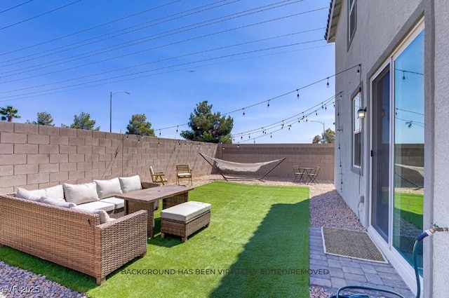 5692 Tinar St, Las Vegas, NV 89113 - view of yard with a fenced backyard and an outdoor living space