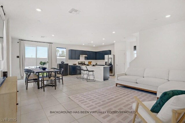 5692 Tinar St, Las Vegas, NV 89113 - living room with light tile patterned floors and recessed lighting