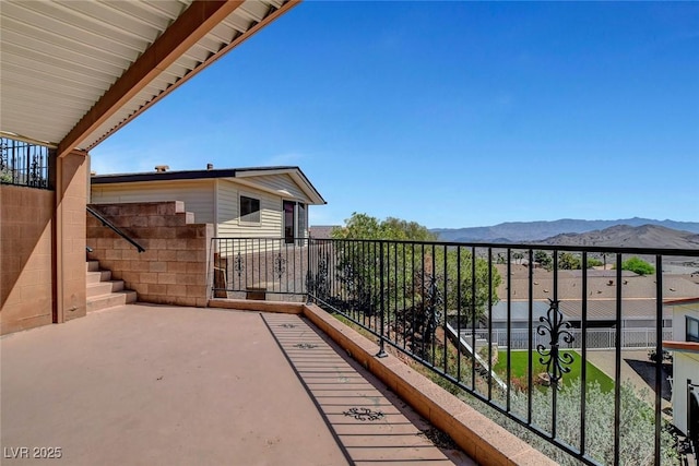 balcony featuring a mountain view