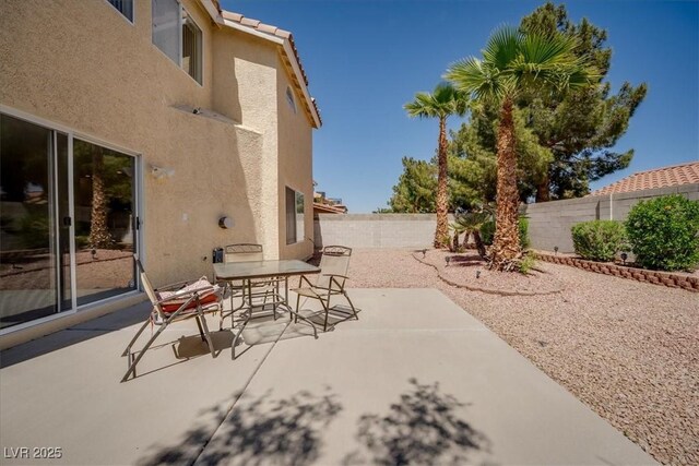 view of patio / terrace featuring outdoor dining space and a fenced backyard