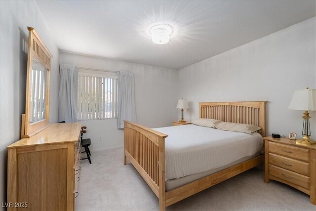 bedroom with light colored carpet